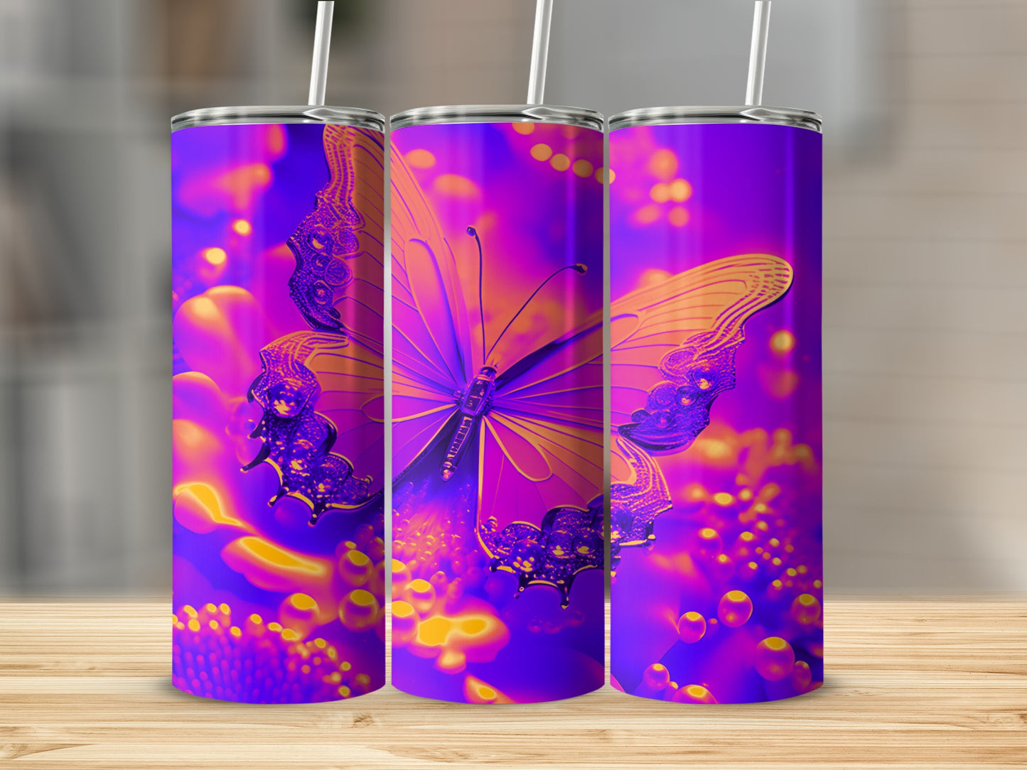 Purple and gold butterfly art on three tumblers.
