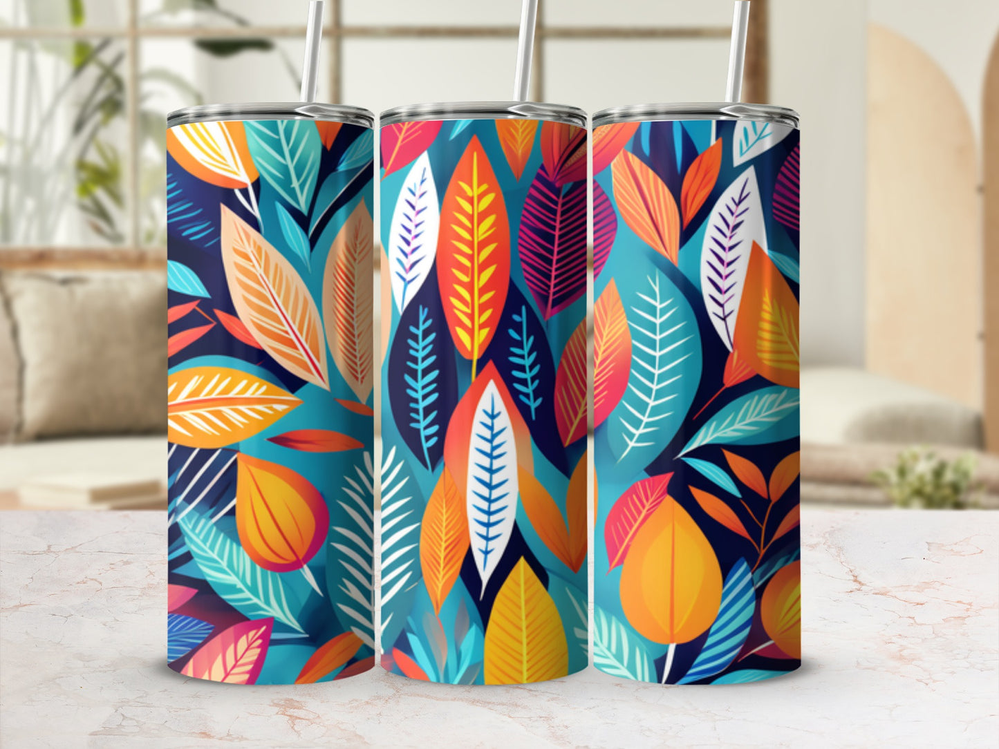 Three tumblers with a vibrant teal and orange leaf pattern.