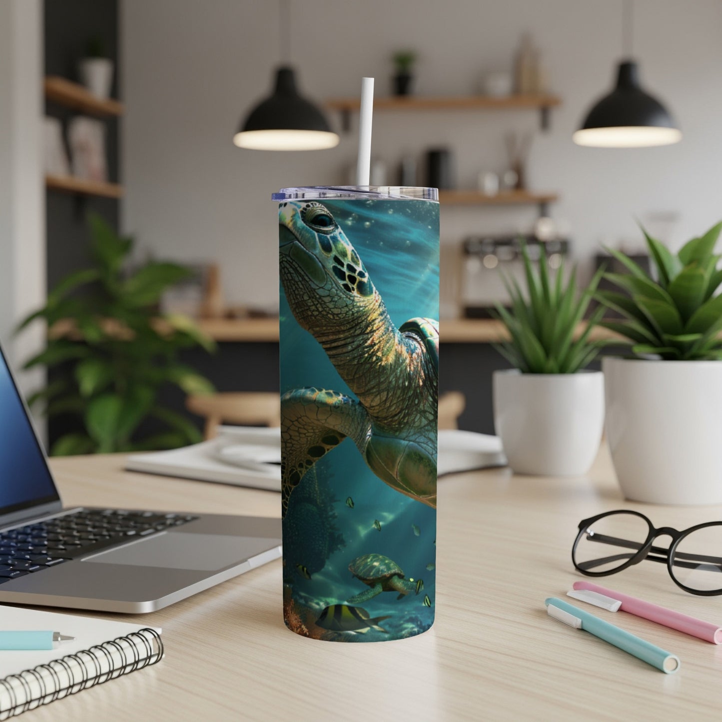 Sea turtle swimming underwater on a tall, insulated tumbler with a straw.