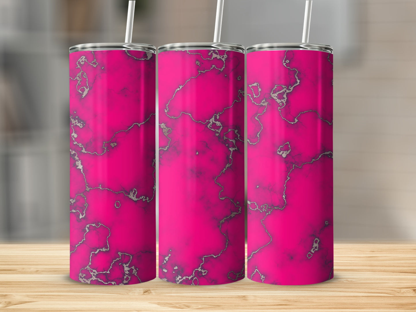 Three bright pink tumblers with a silver marble pattern on a wooden surface.