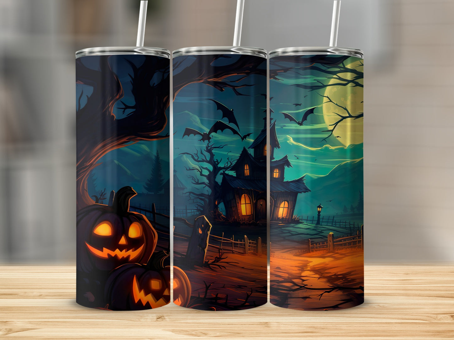 Three tumblers with a Halloween scene featuring jack-o'-lanterns and a haunted house.