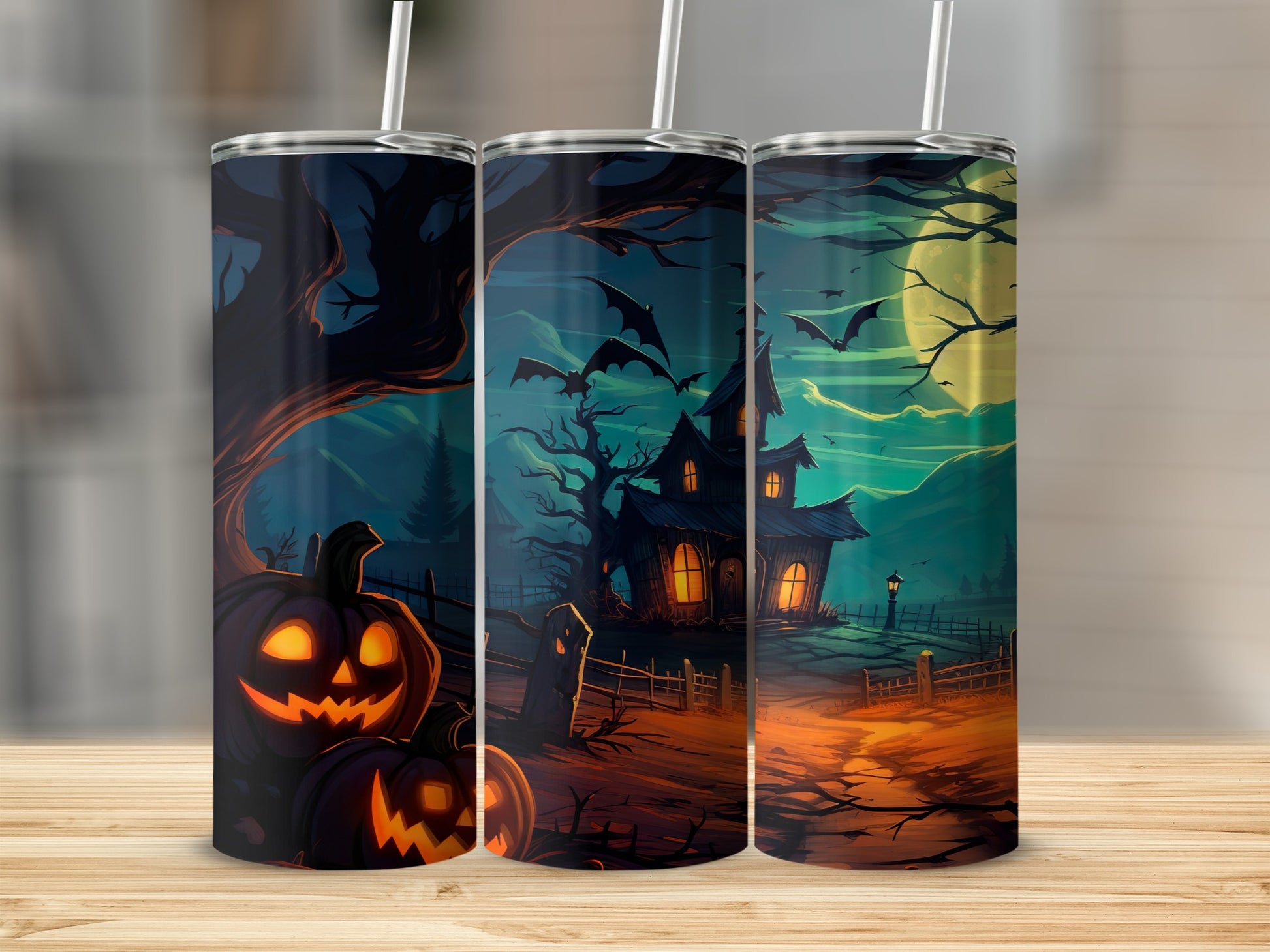 Three tumblers with a Halloween scene featuring jack-o'-lanterns and a haunted house.