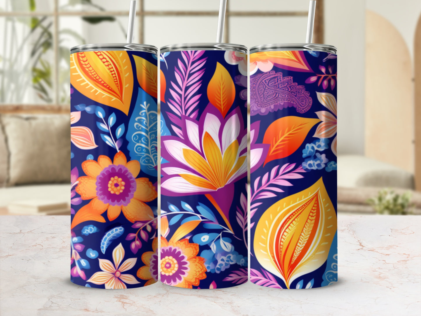 Three tumblers with a colorful floral and paisley pattern on a navy background.