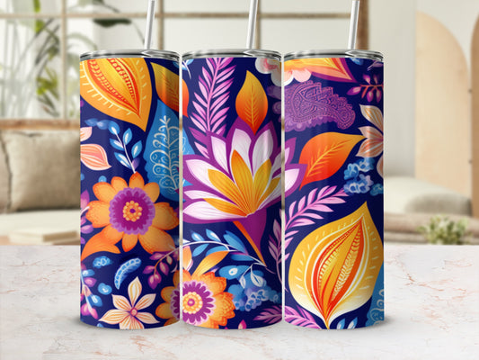 Three tumblers with a colorful floral and paisley pattern on a navy background.