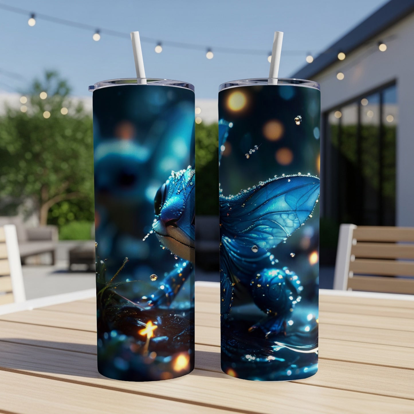 Two tall tumblers with a blue dragon design, outdoors.