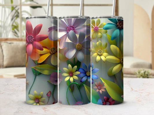 Three tumblers with colorful floral designs, each with a straw.