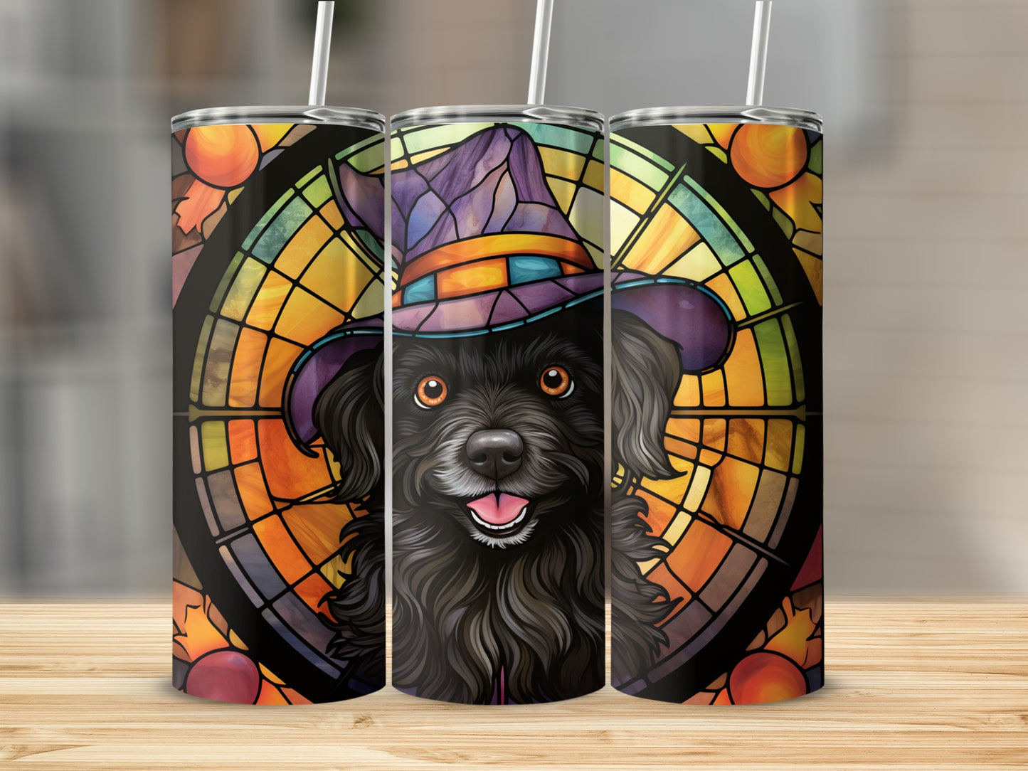 Black dog wearing a witch hat with stained glass fall leaves background.