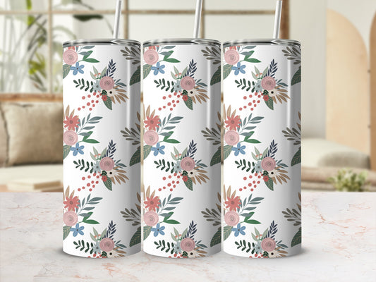 Three tumblers with floral and berry pattern on marbled surface.