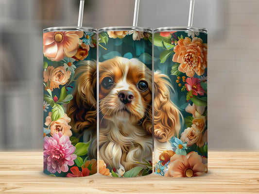 Three tumblers featuring a Cavalier King Charles Spaniel surrounded by colorful flowers.