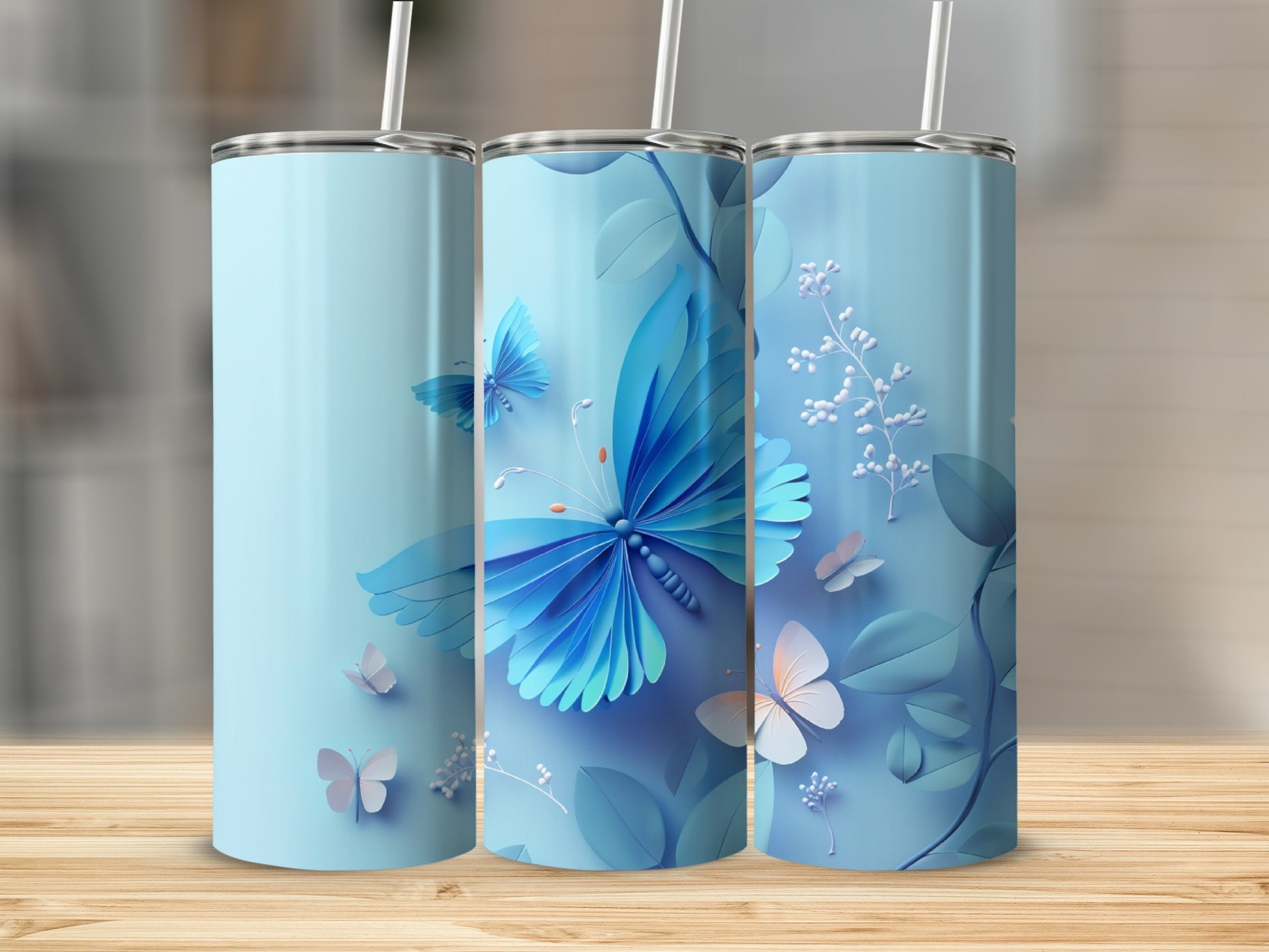 Blue tumbler with delicate butterflies and floral accents.