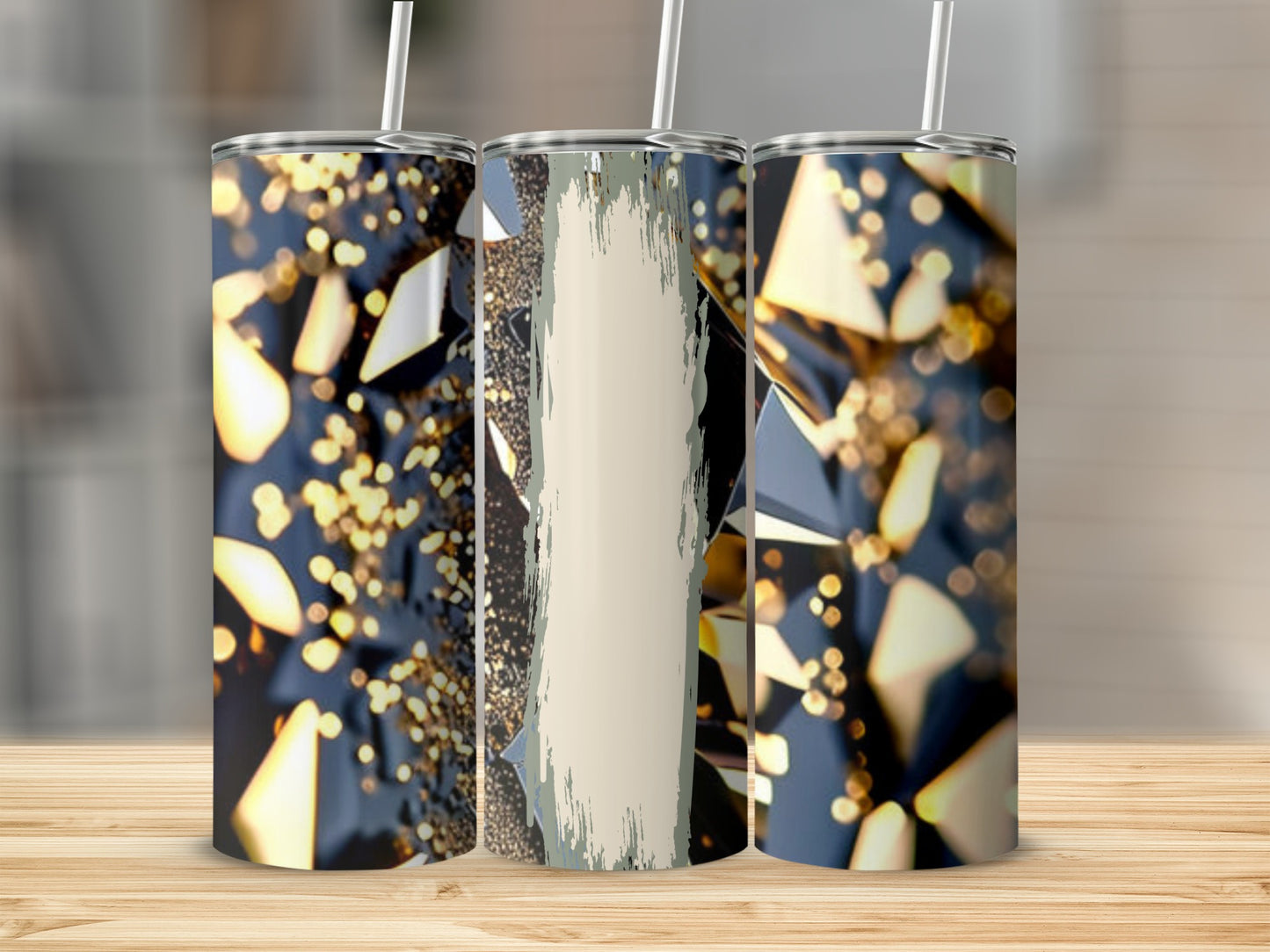 Three tumblers with abstract geometric patterns and gold glitter.