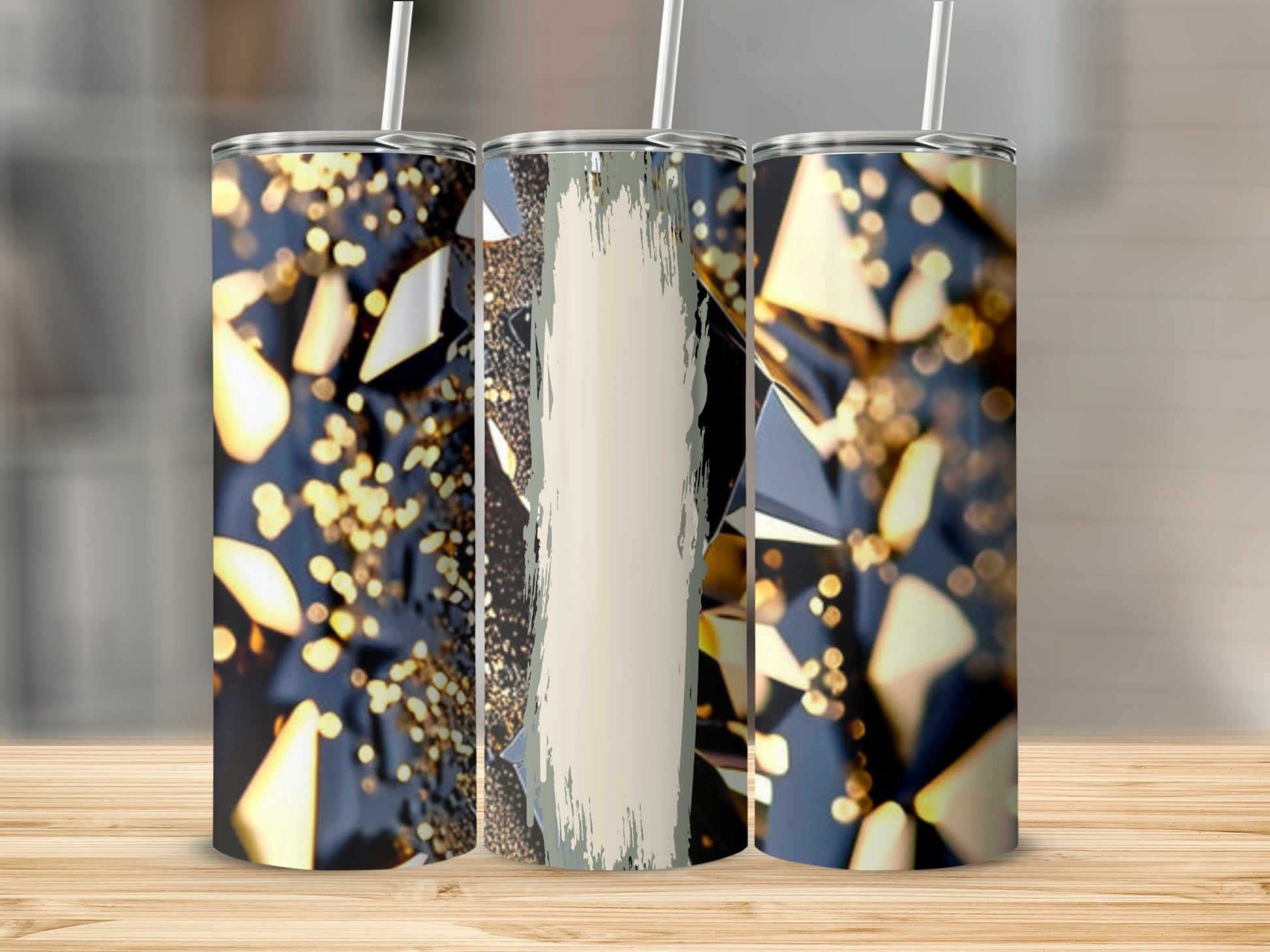 Three tumblers with abstract geometric patterns and gold glitter.