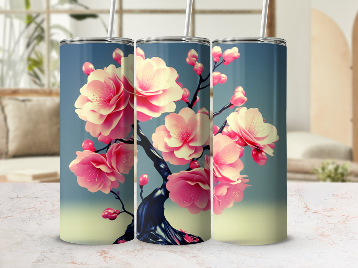 Three tumblers with pink cherry blossoms on a blue and yellow gradient background.