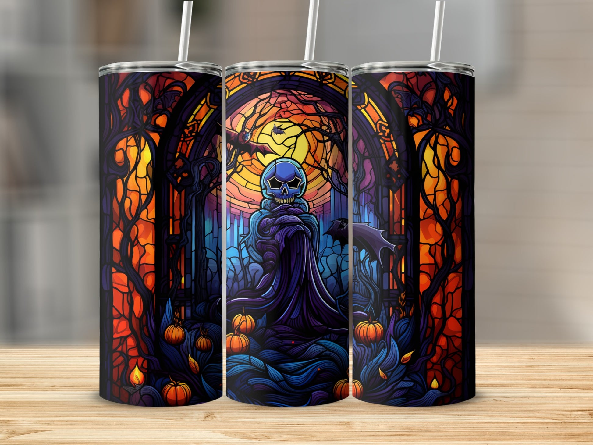 Three Halloween-themed tumblers with a dark fantasy scene featuring a skull figure and pumpkins.