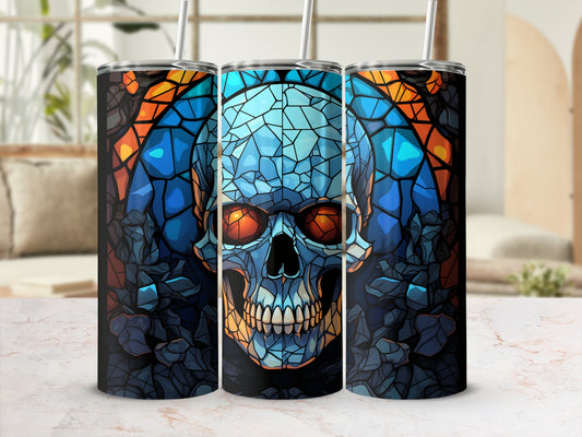 Three stained-glass skull tumblers with colorful, geometric patterns.
