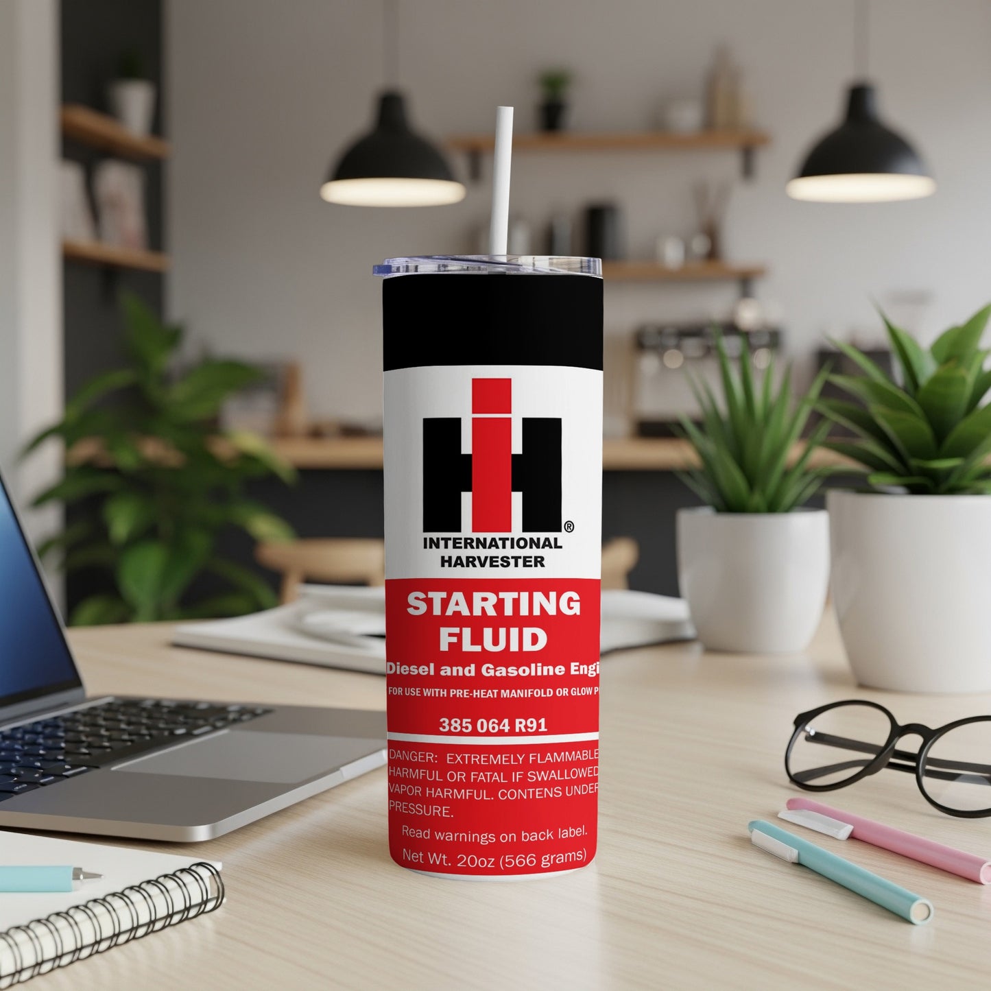 International Harvester Starting Fluid metal tumbler with product information.