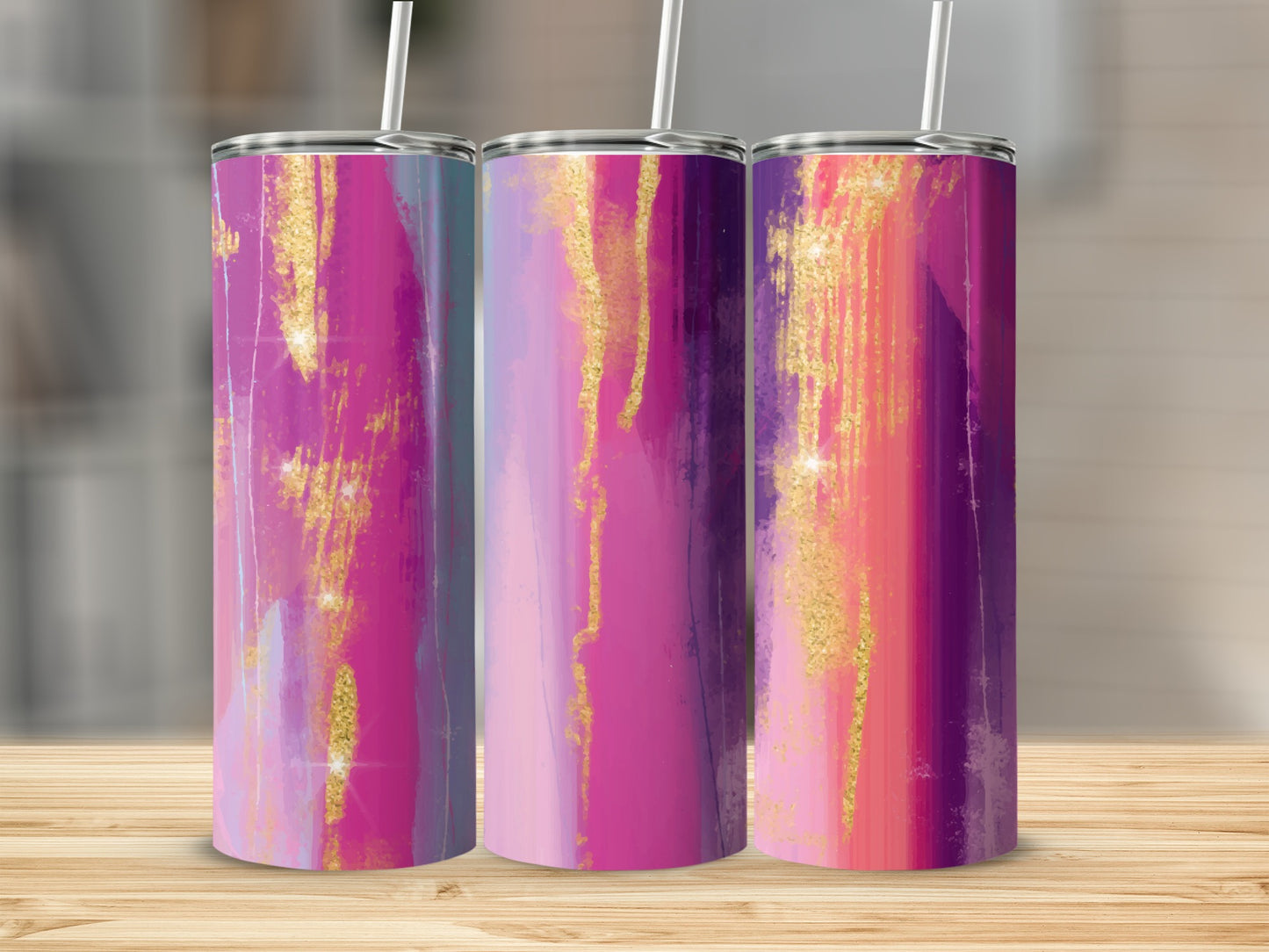 Three tumblers with abstract pink, purple, and gold watercolor designs.