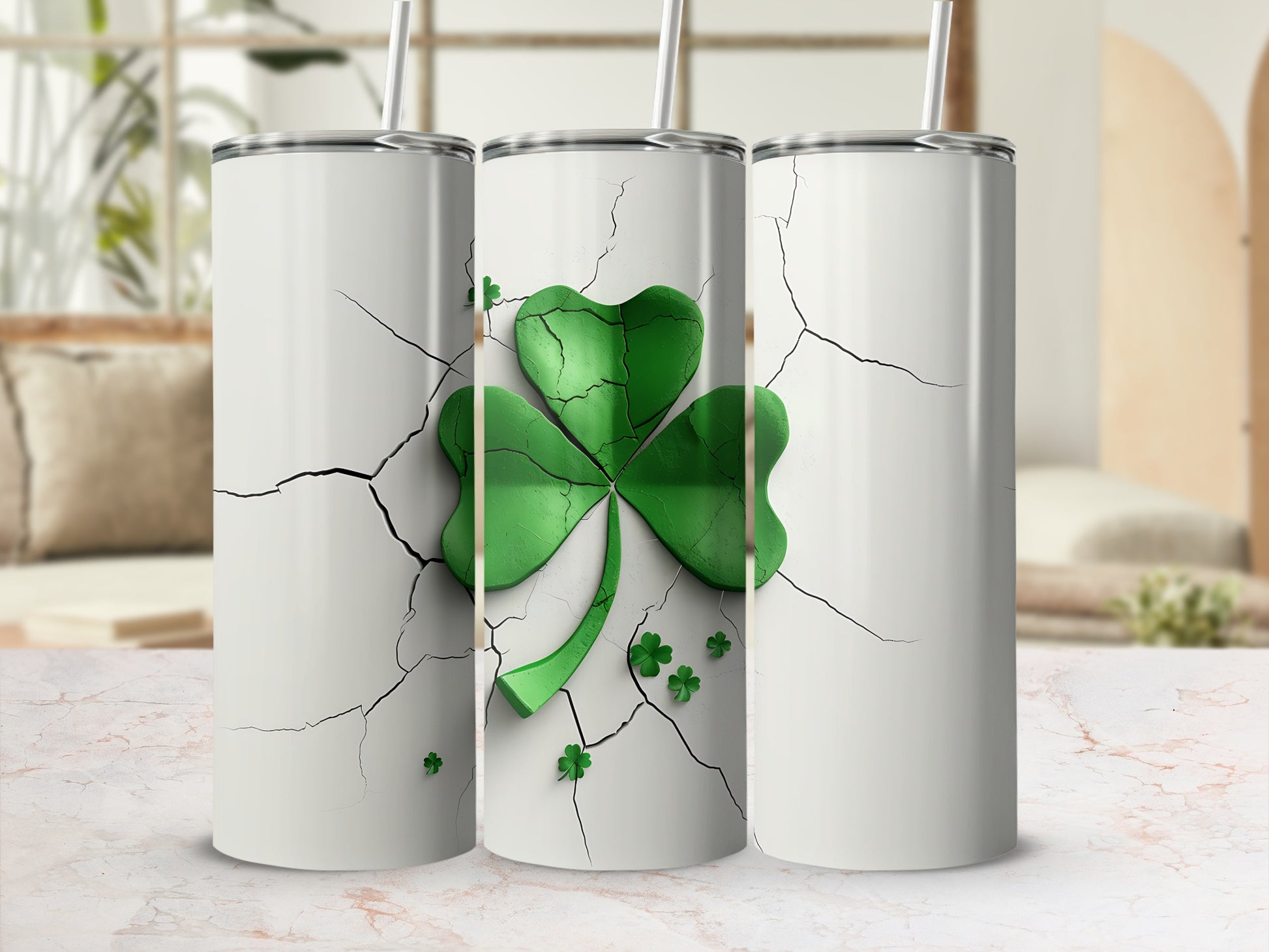 Three white tumblers with cracked surfaces and a green shamrock design.