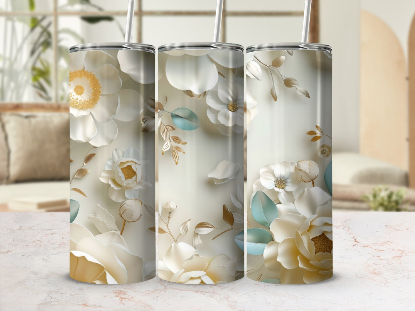 Floral tumbler with white and gold flowers and green leaves.