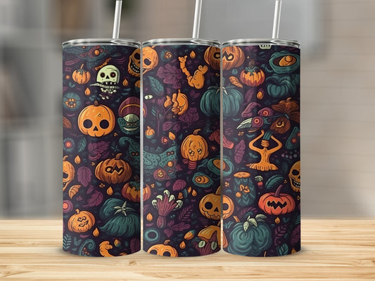 Three tumblers with a Halloween pattern of pumpkins, skulls, and leaves.