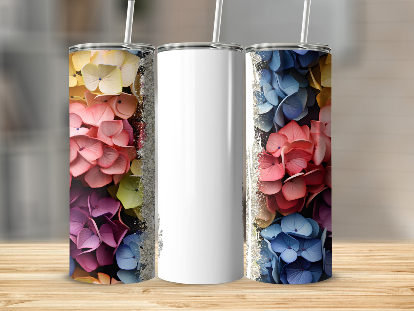 Three tumblers with floral designs and glitter accents.