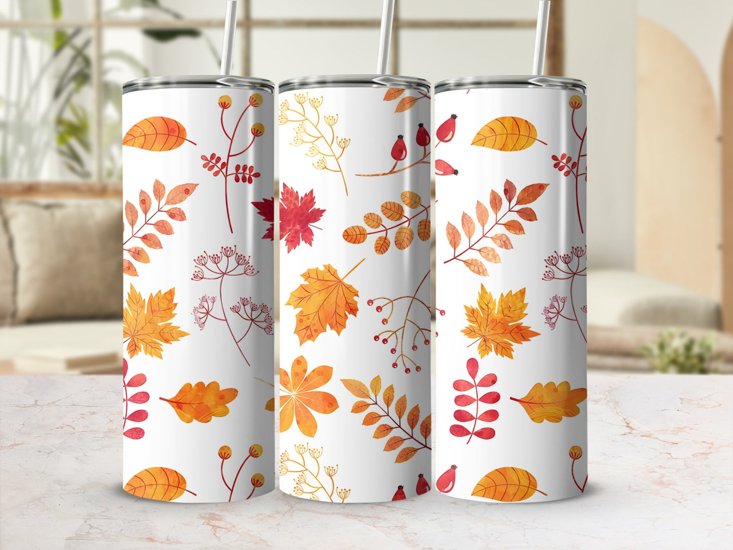 Three tumblers with autumn leaf and berry designs.
