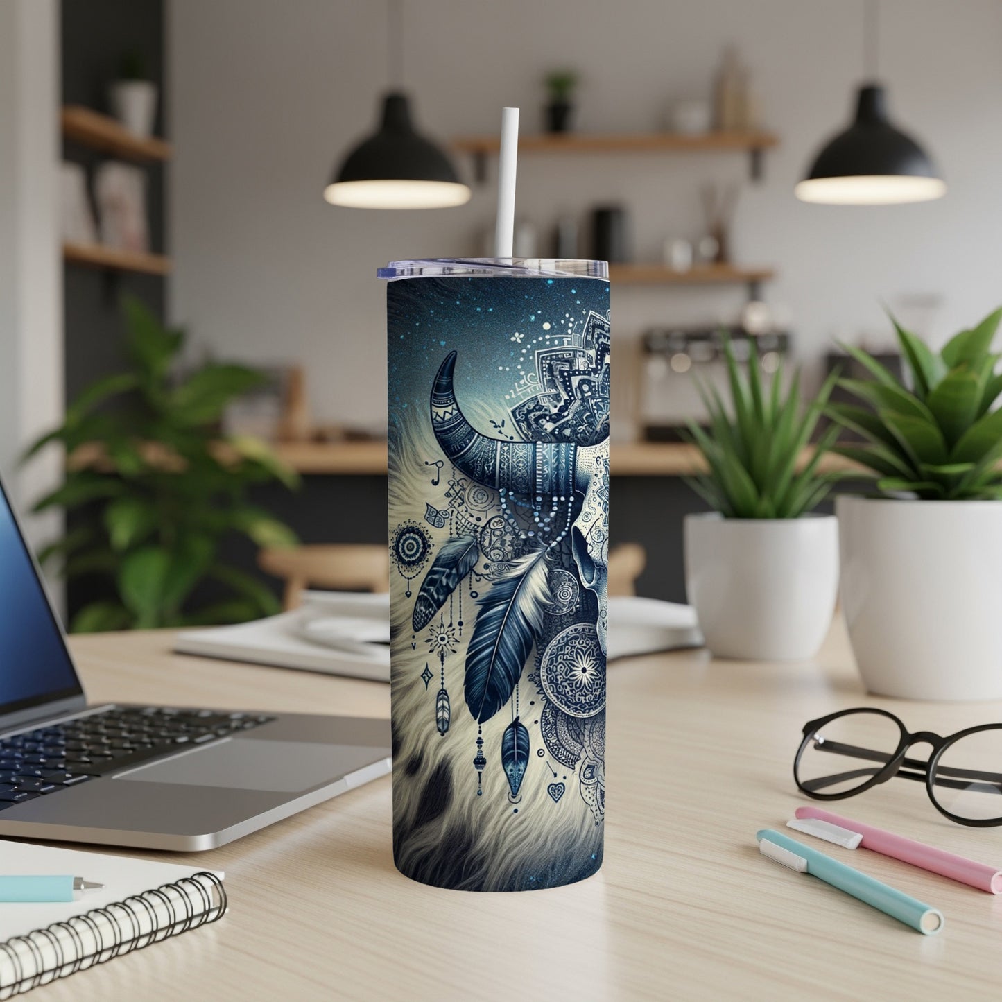 Blue celestial bull skull tumbler with feathers and intricate patterns.