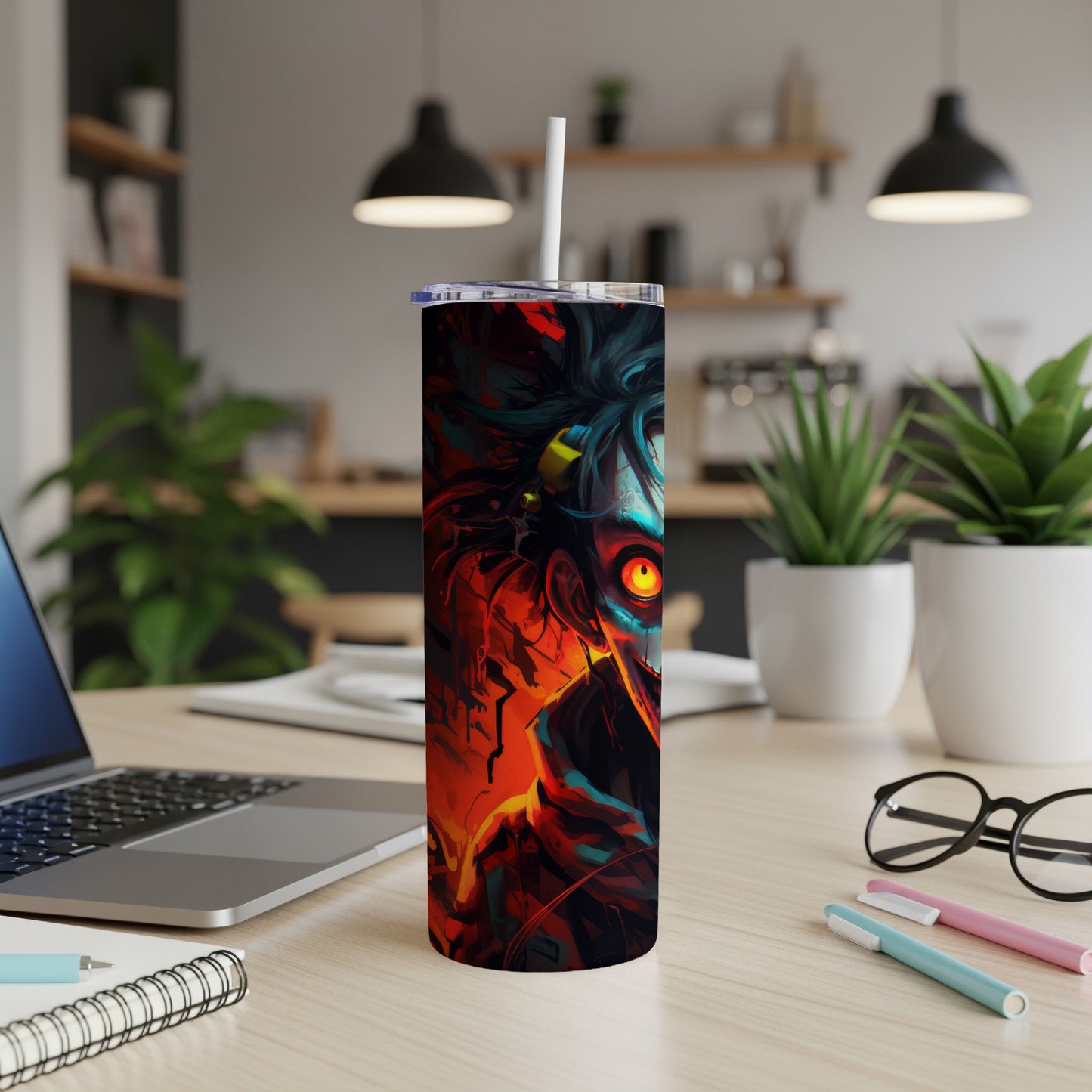 Tumbler with a vibrant, abstract illustration of a character's face with bright orange eyes.