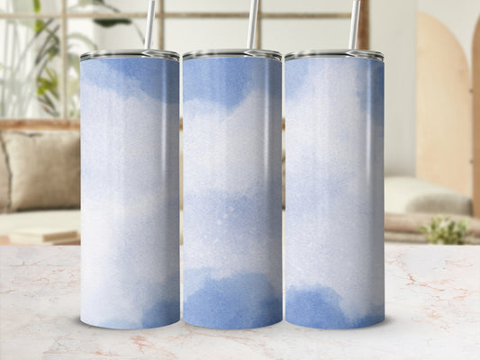 Three blue watercolor patterned tumblers with straws, displayed on a marble surface.
