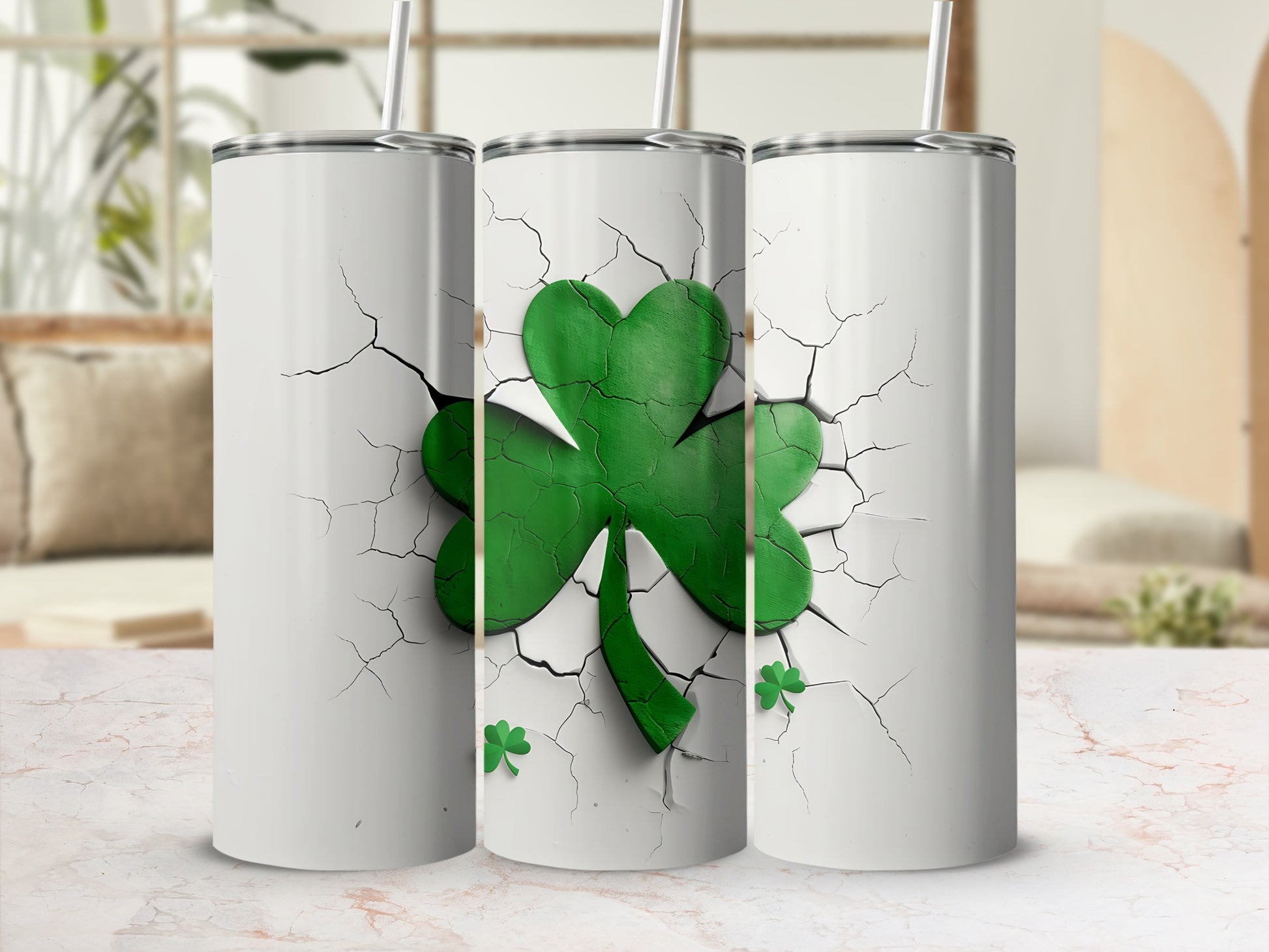 Three white tumblers featuring a cracked white surface revealing a green shamrock.