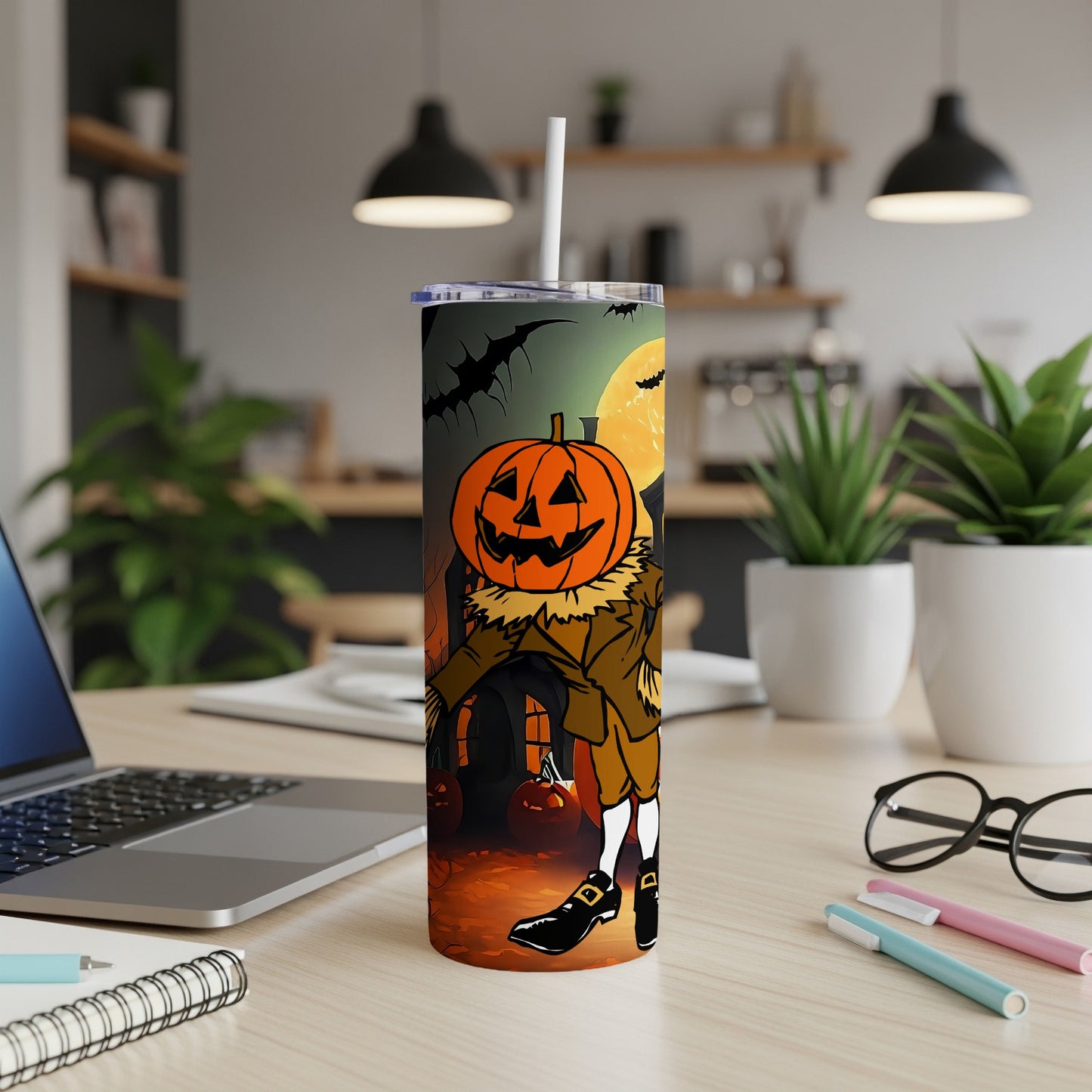 Tumbler with pumpkin scarecrow and Halloween scene, including bats and full moon.