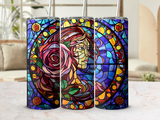 Stained glass tumbler with profile of a woman's face intertwined with a rose.