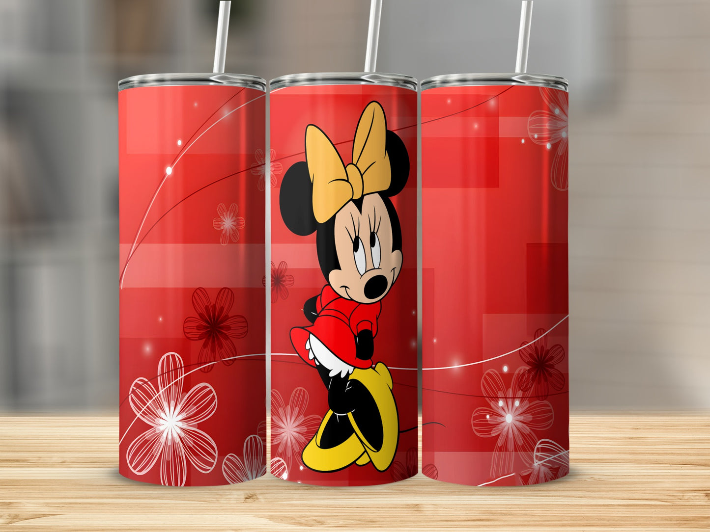 Minnie Mouse on a red tumbler with floral accents and white swirls.