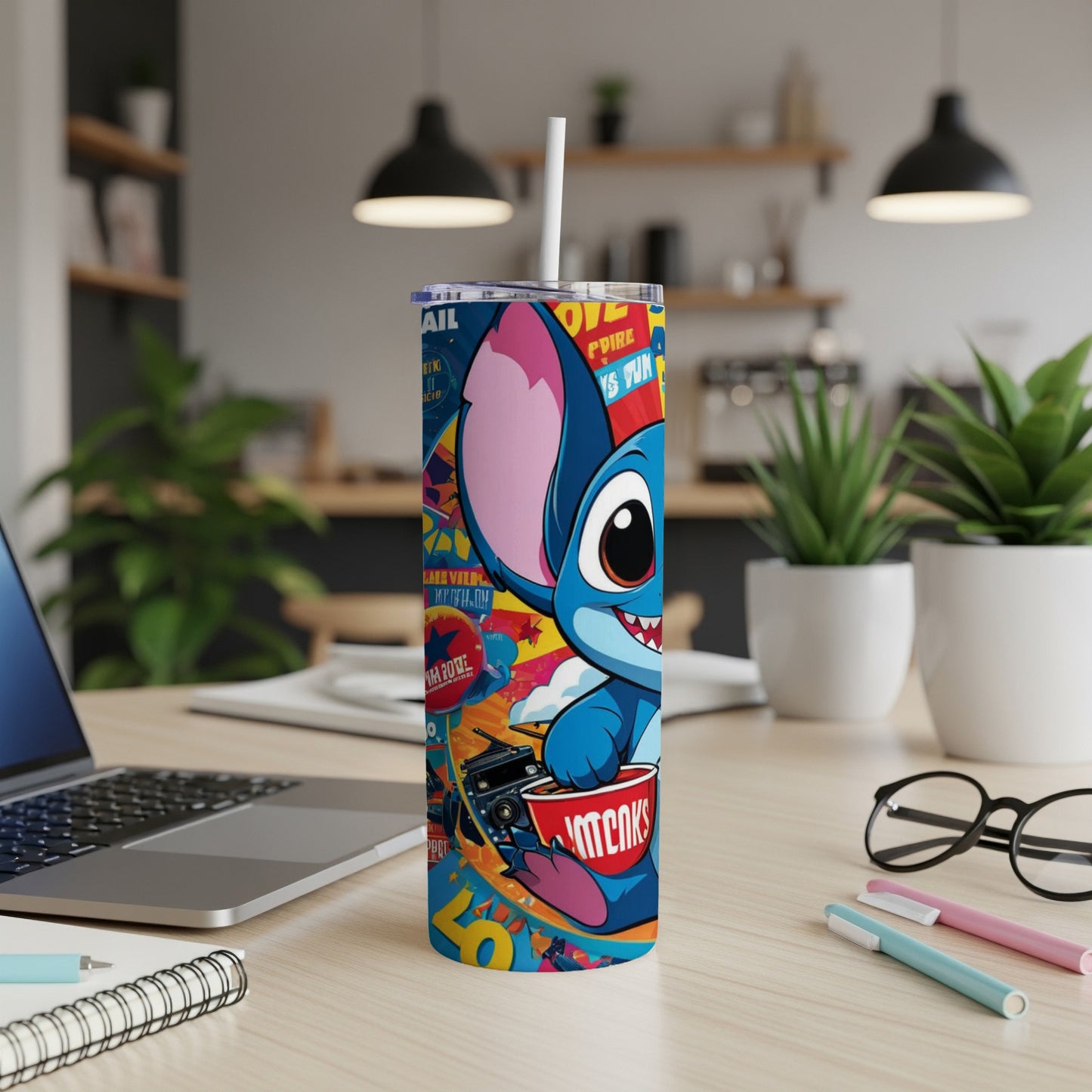Blue cartoon character with large ears on a tumbler with colorful graphic art.
