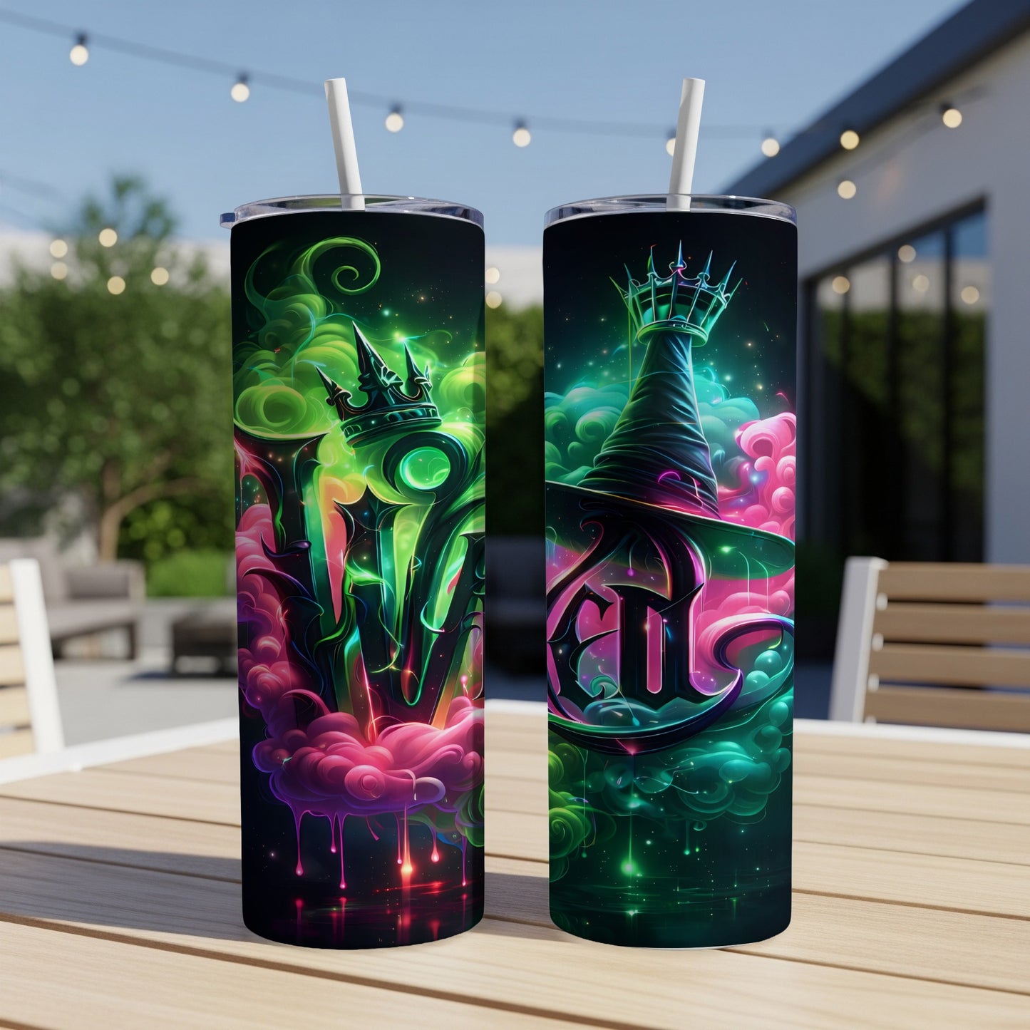 Two tumblers with fantasy-themed designs of crowns, witches hats, and swirling smoke.