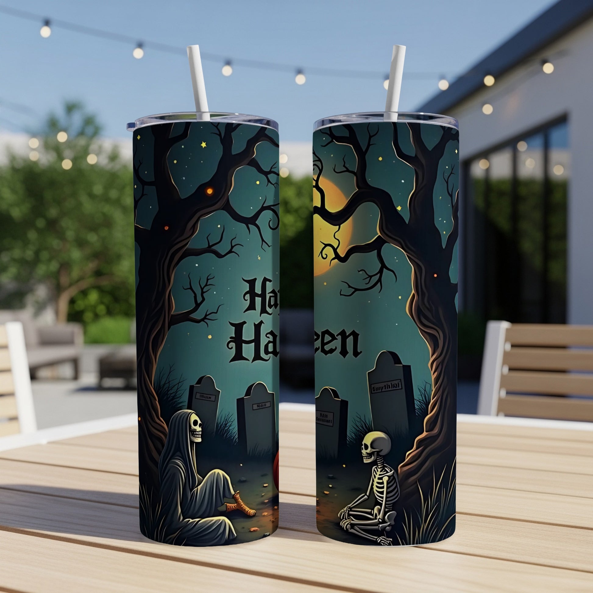 Halloween themed tumblers with skeletons and gravestones on a nighttime landscape.