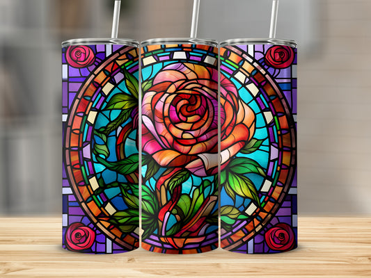 Three tumblers featuring stained glass rose art on a wooden surface.
