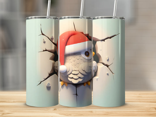 Three mint green tumblers, one with a cartoon owl wearing a Santa hat cracking through.