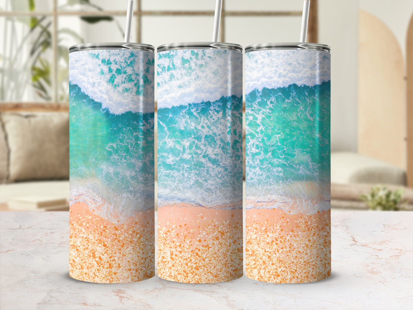 Three tumblers with ocean wave and sandy beach design.