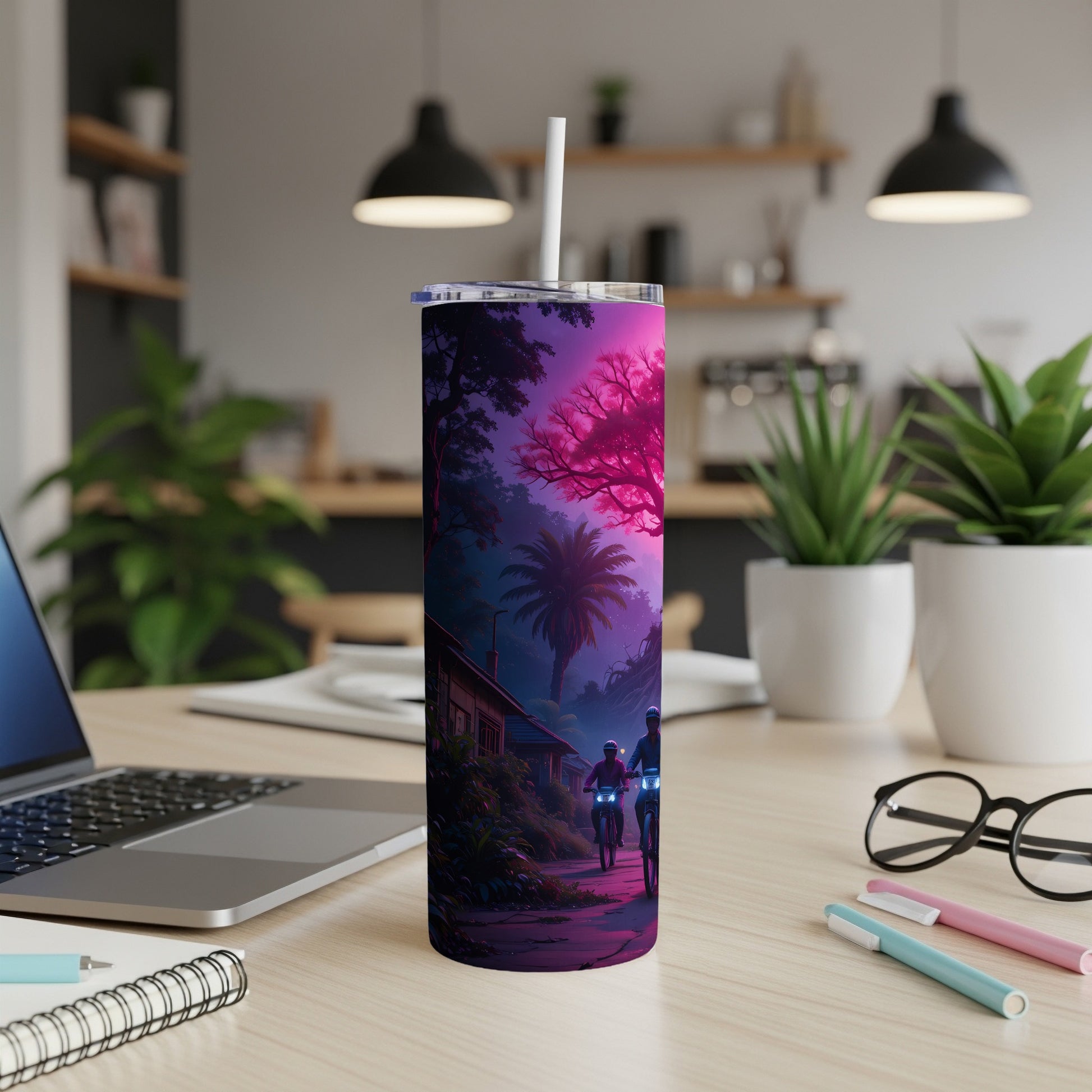Tumbler with pink and purple night scene of people riding bicycles past a house.