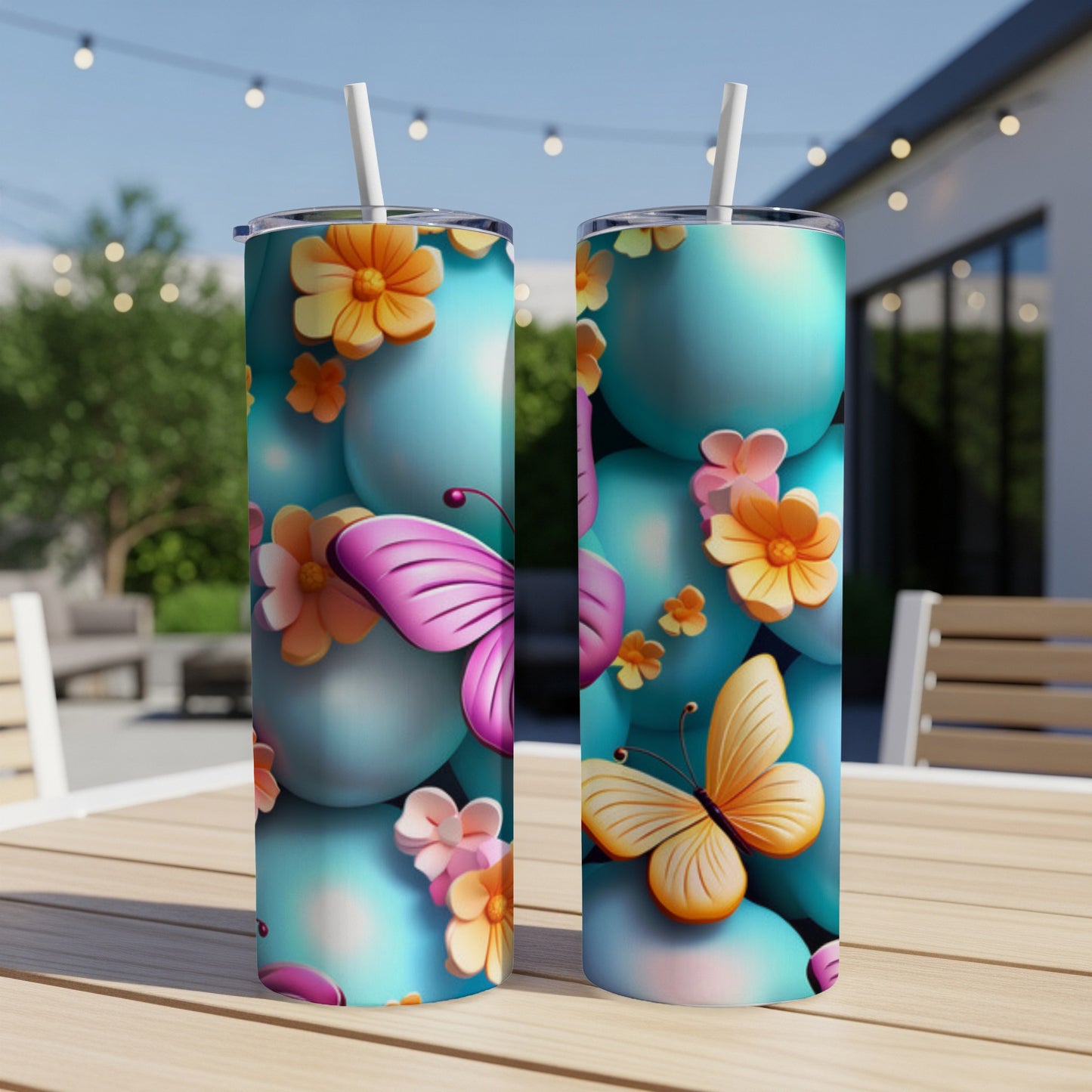 Two tumblers with teal balloons, butterflies, and flowers.