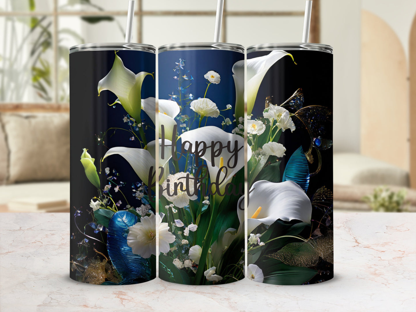 White calla lilies and greenery adorn a tumbler with "Happy Birthday" text.