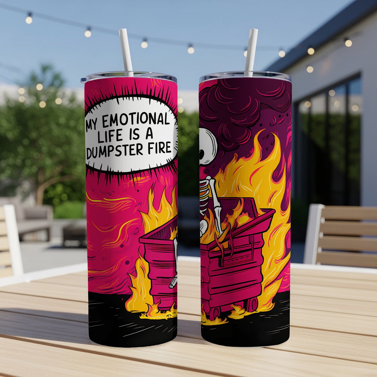 Tumbler with skeleton in burning dumpster graphic and text "My emotional life is a dumpster fire".