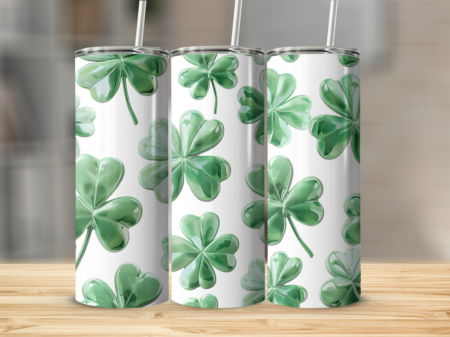 Three tumblers with a seamless pattern of green shamrocks.