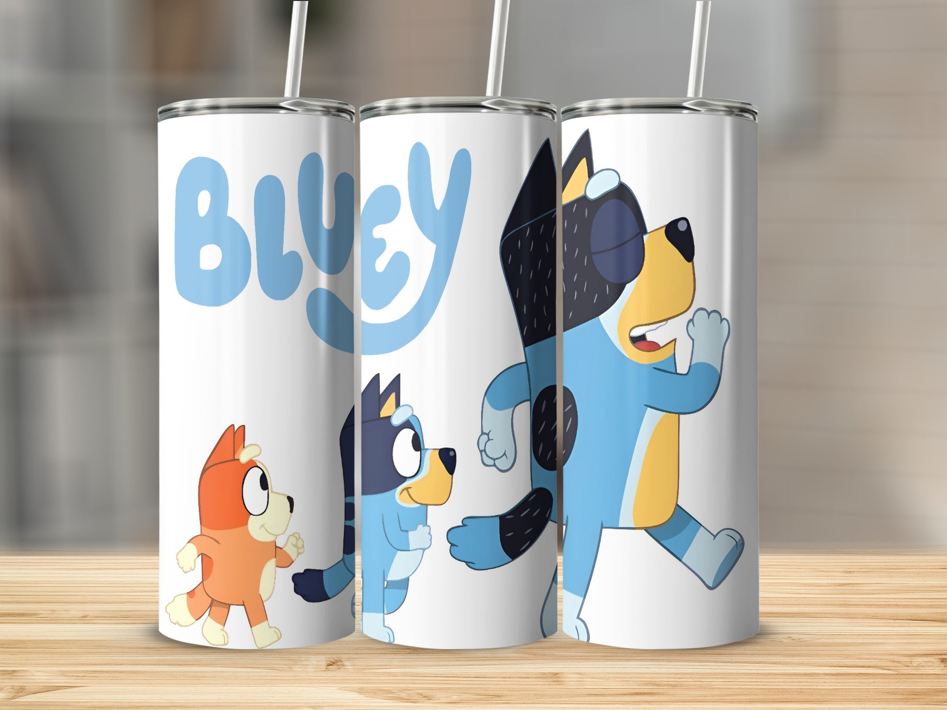 Bluey characters on a white insulated tumbler with straws.