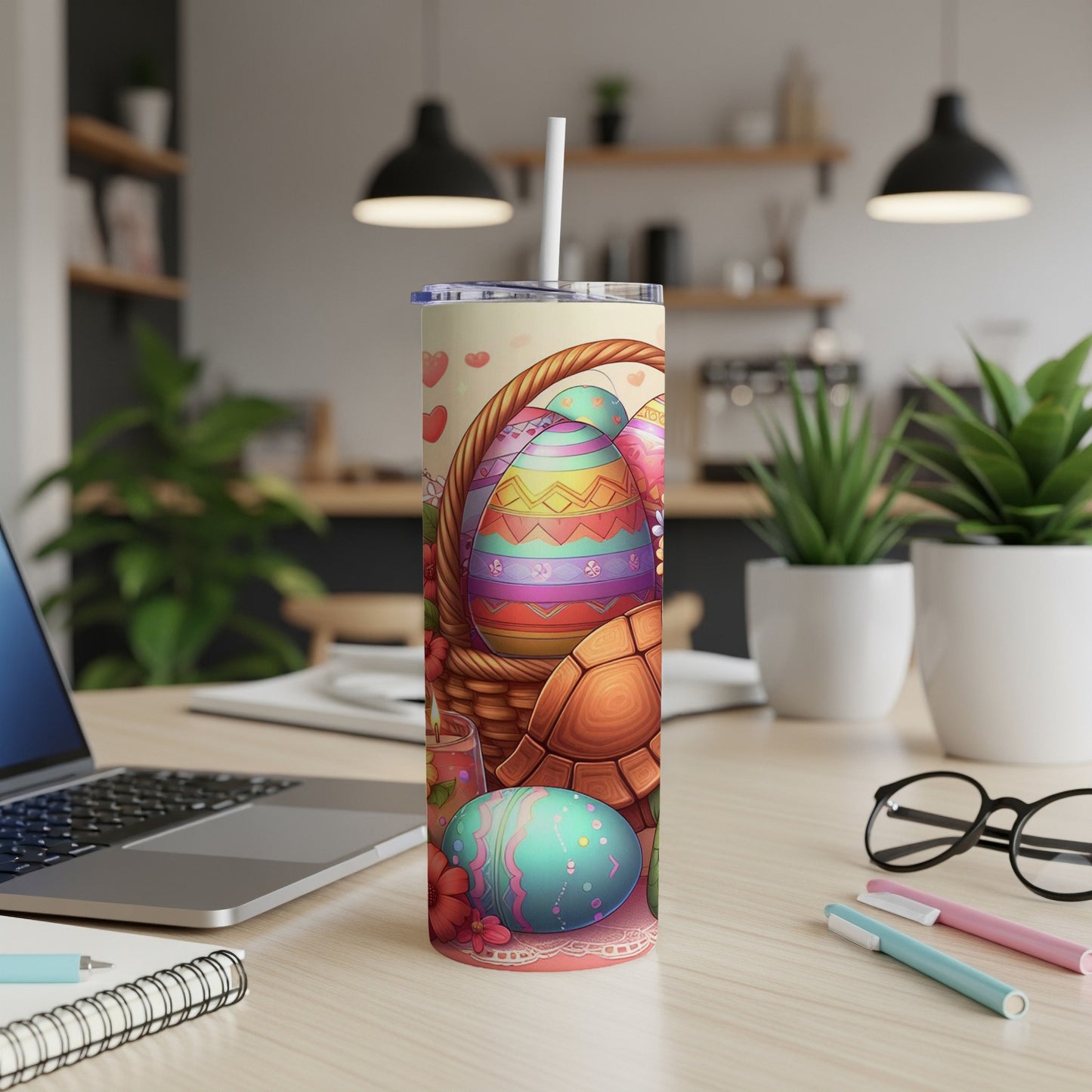 Easter tumbler with colorful eggs, basket, and turtle on a desk.