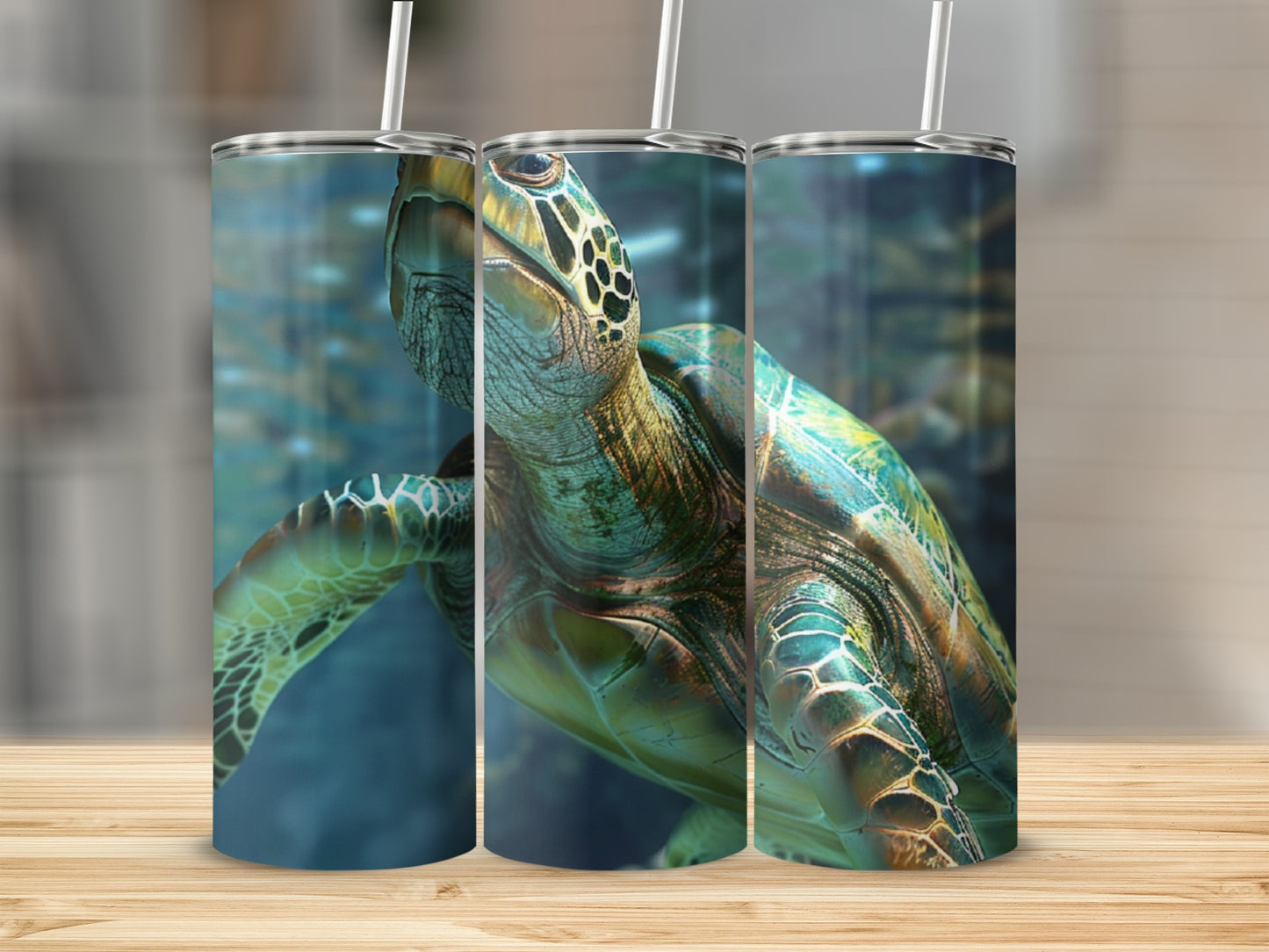 Sea turtle design on three tumblers with straws.