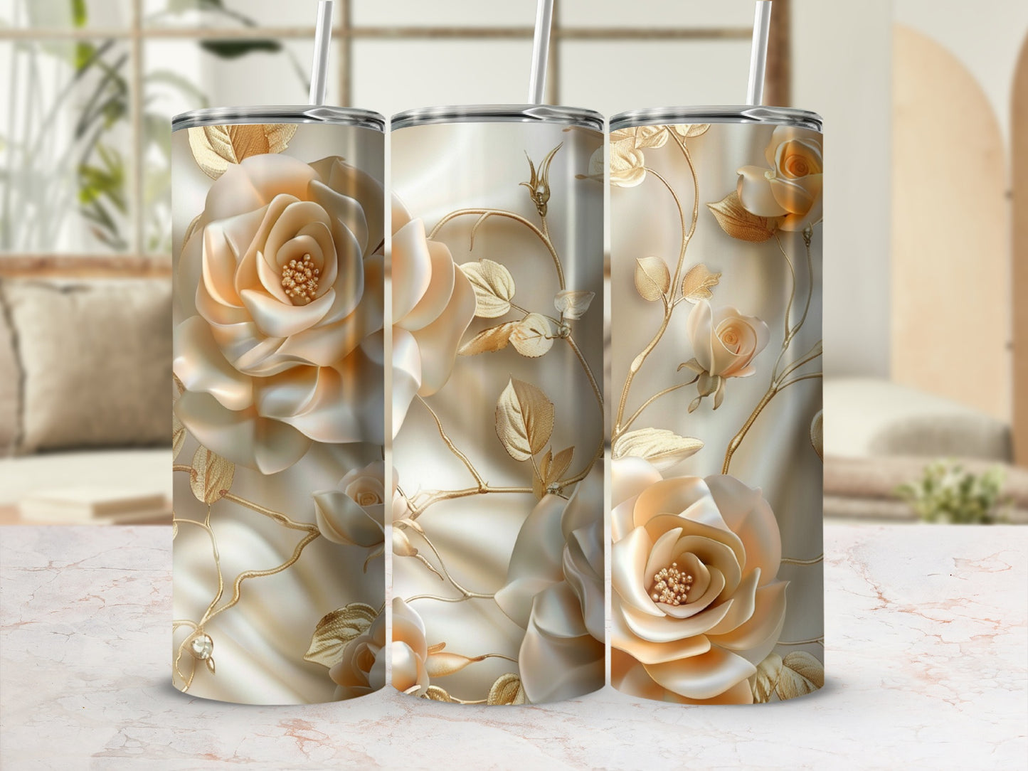 Gold floral pattern on three seamless tumblers with straws.