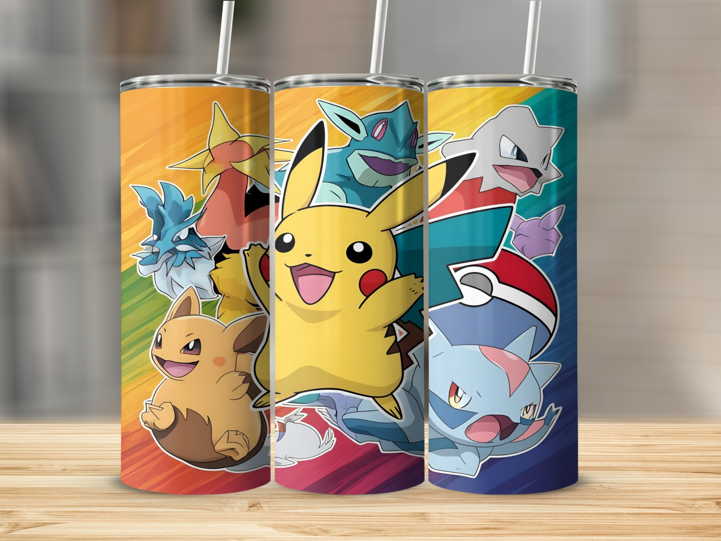Three Pokémon tumblers featuring Pikachu, Gible, and other characters on a rainbow background.