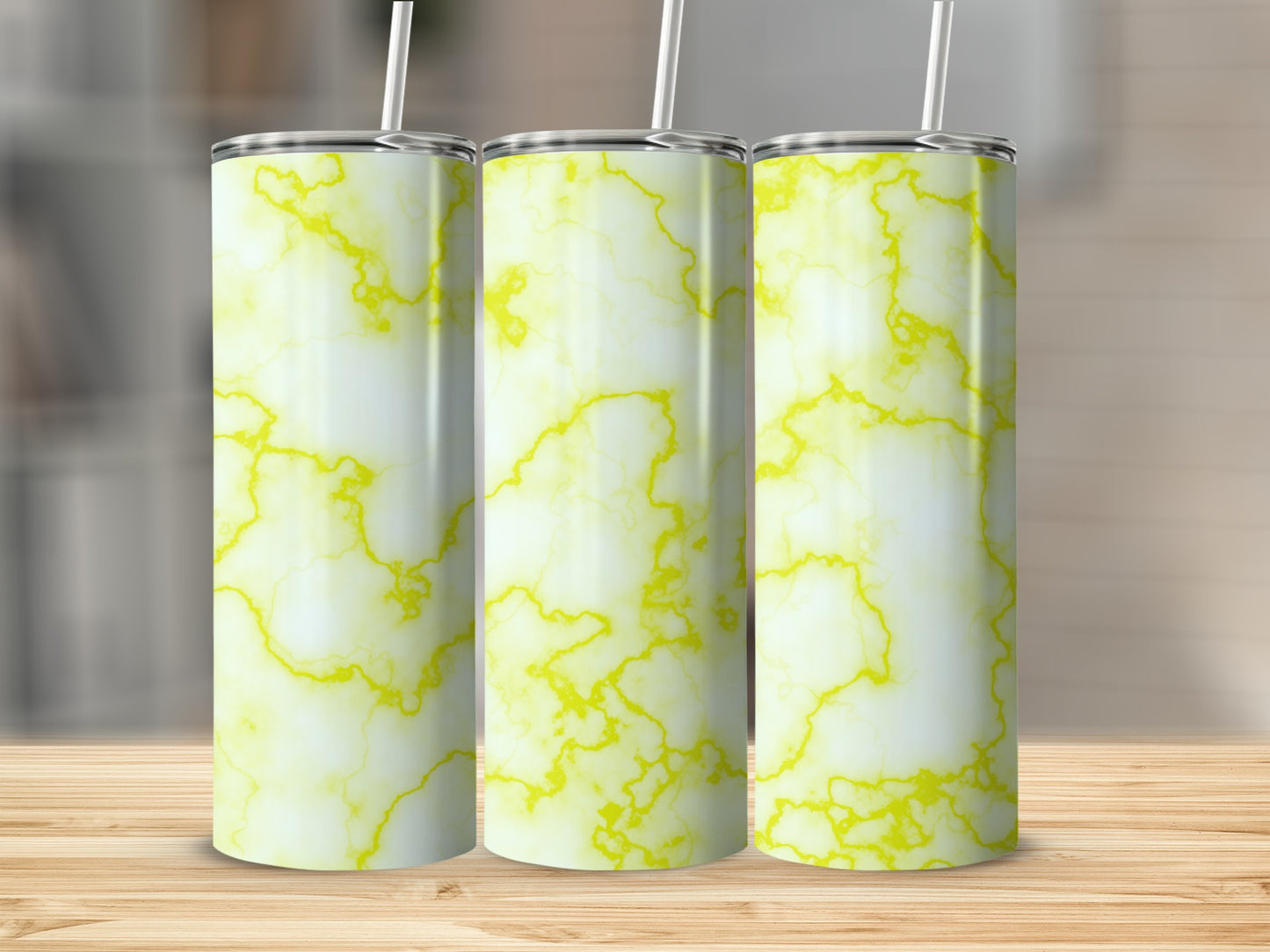 Three tall, cylindrical tumblers with a white and yellow marble pattern.
